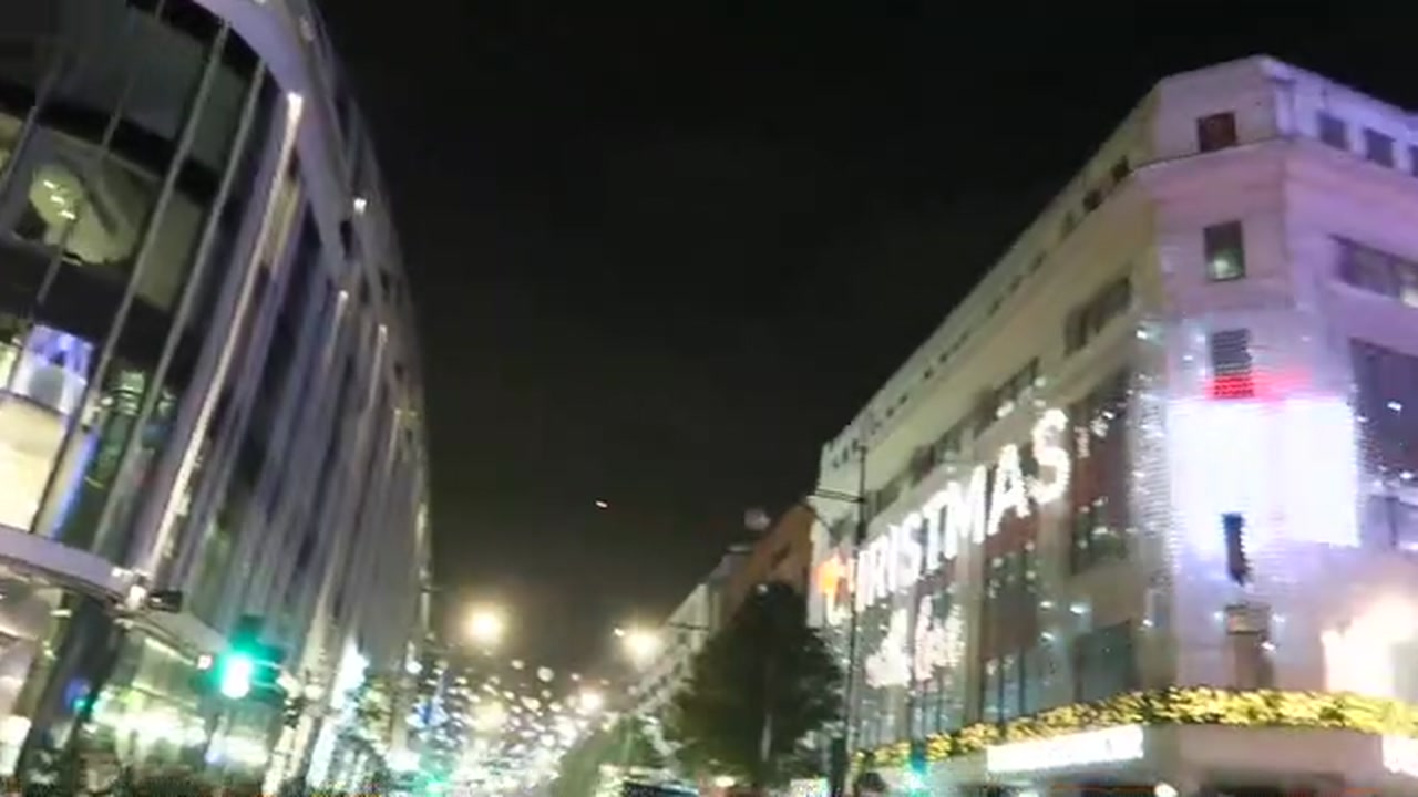 Christmas projection across an Oxford Street department-store façade in 2016