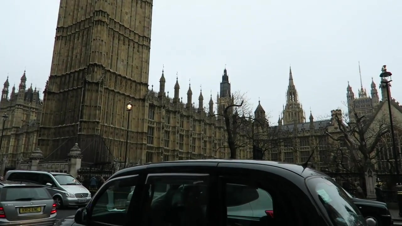 Black cab passing the Palace of Westminster on New Year’s Eve