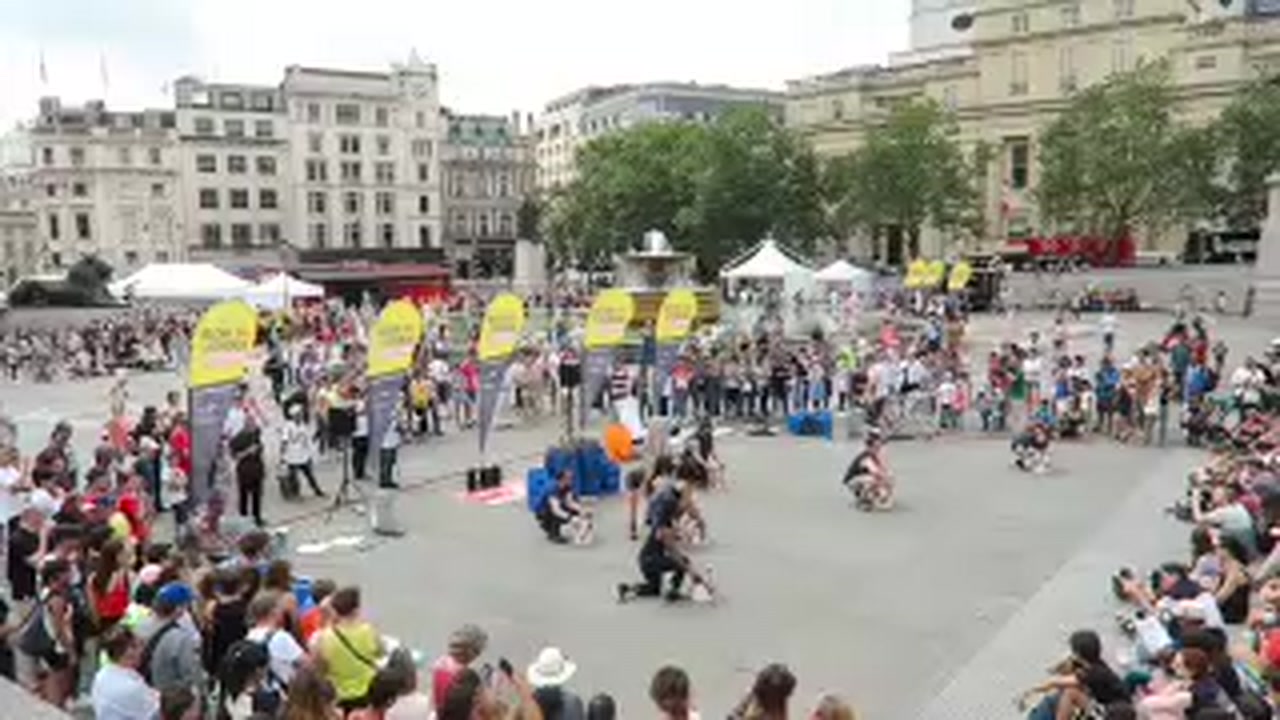 STOMP performing before a large crowd in Trafalgar Square during the Busk in London festival.