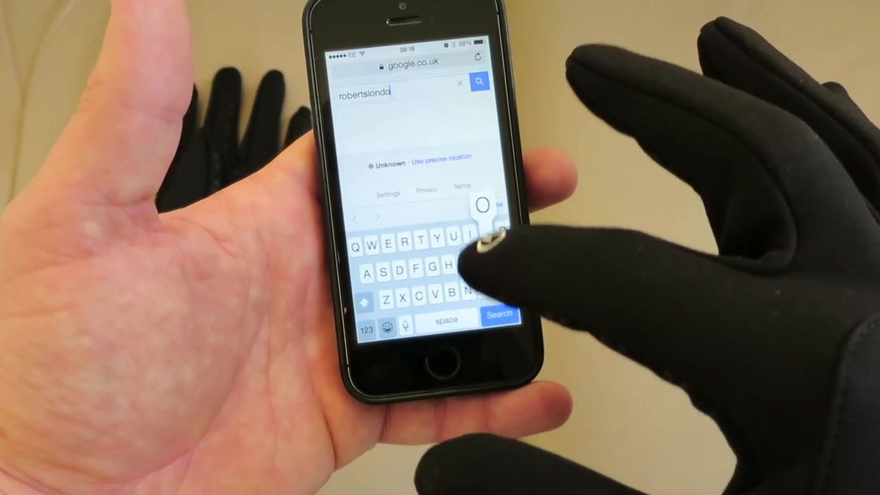 Testing a North Face Etip glove on an iPhone touchscreen