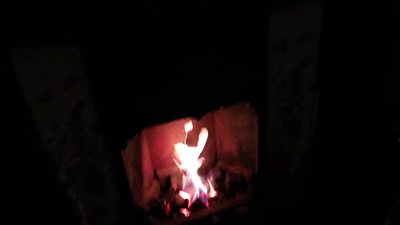 Small open fire glowing inside the Chandos pub near Trafalgar Square