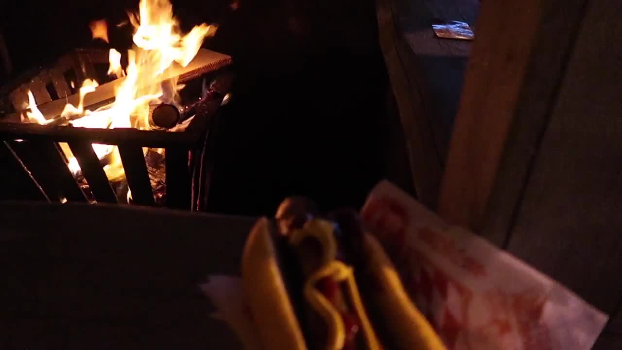 Hot filled roll held beside an open fire at Hyde Park Winter Wonderland in 2017