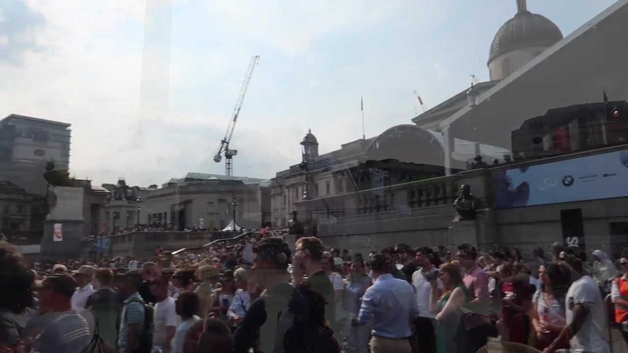 Concert audience filling Trafalgar Square with the National Gallery behind