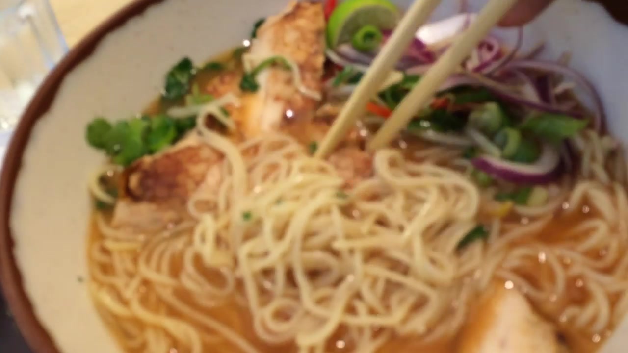 Noodle bowl with vegetables, herbs and egg at Wagamama Soho