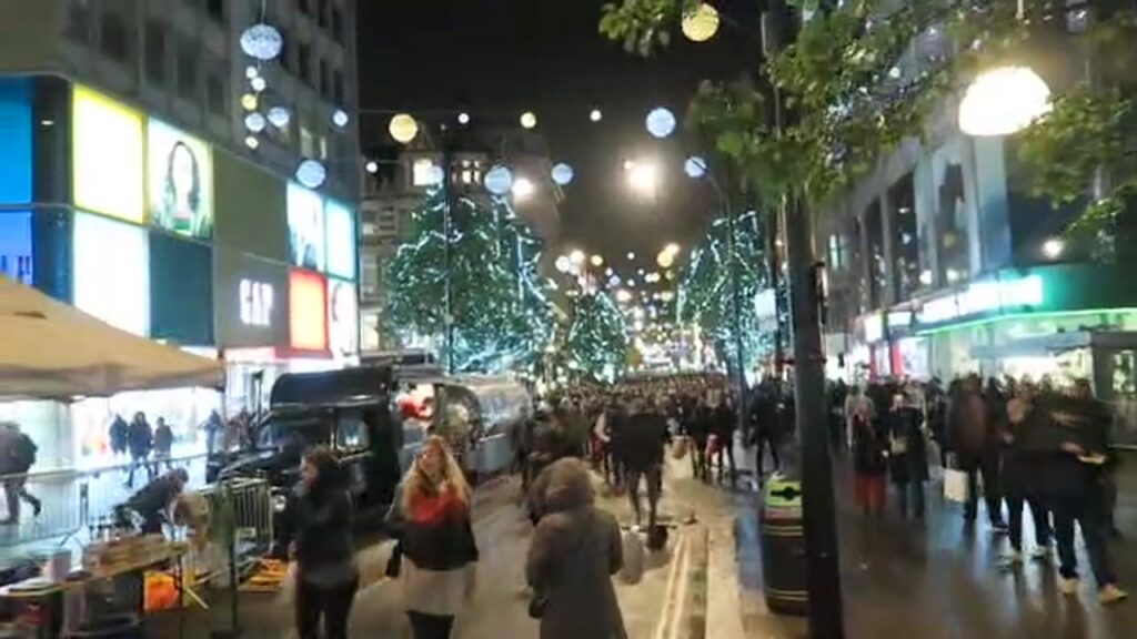 Oxford Street filled with pedestrians beneath the Christmas lights in 2016