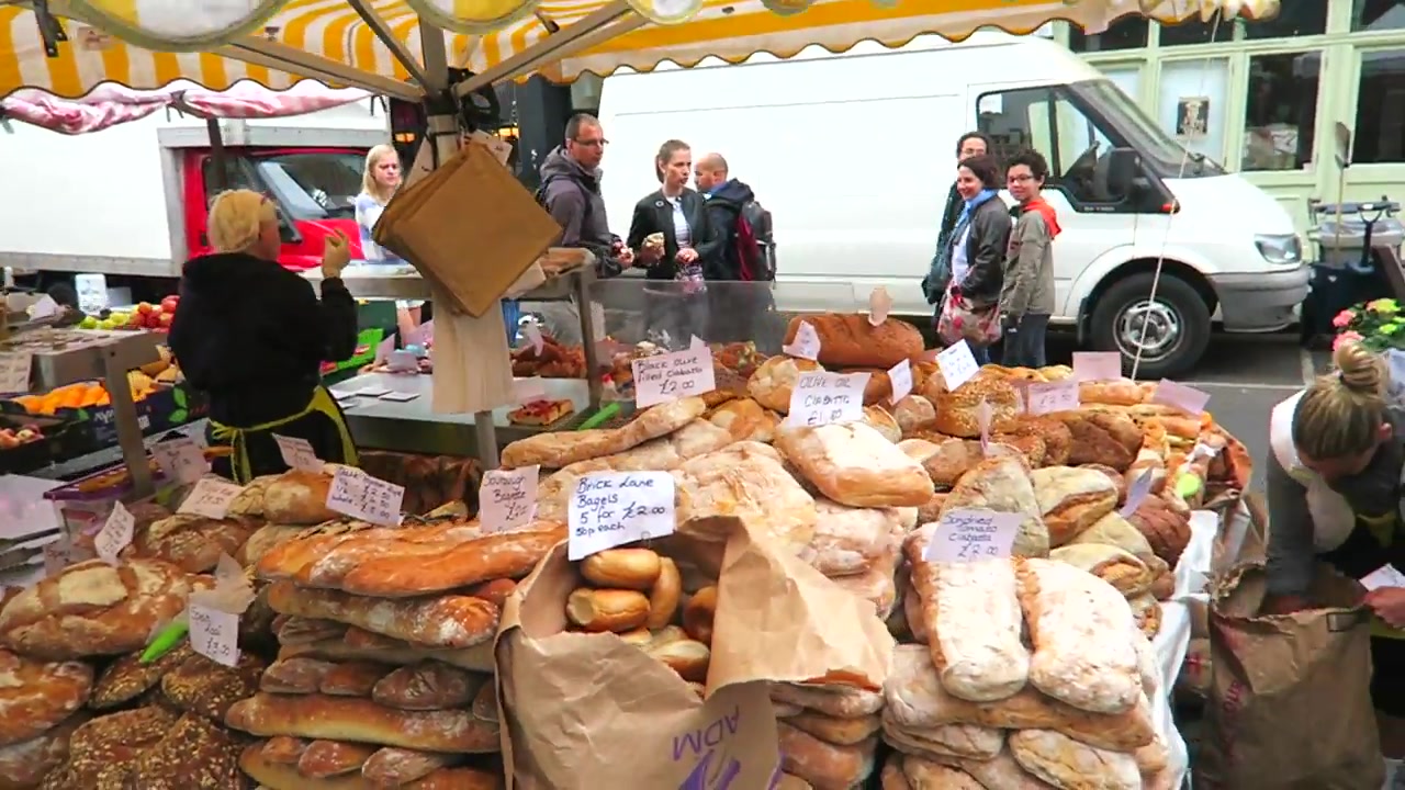 Breads and pastries arranged across a Portobello Road food-market stall