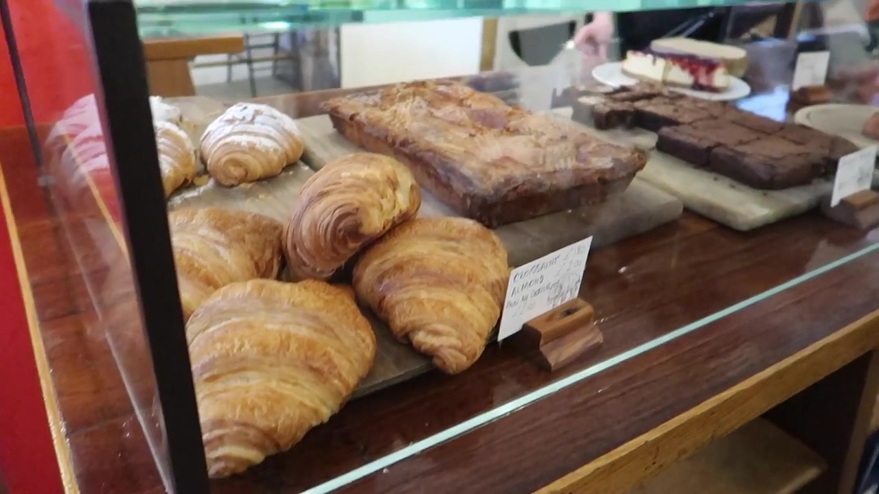 Croissants and pastries displayed inside Prufrock Coffee on Leather Lane