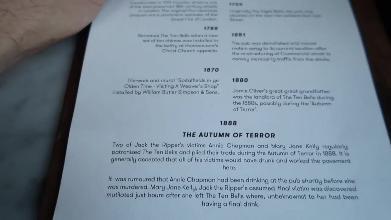 Printed Ten Bells history display describing the Spitalfields pub
