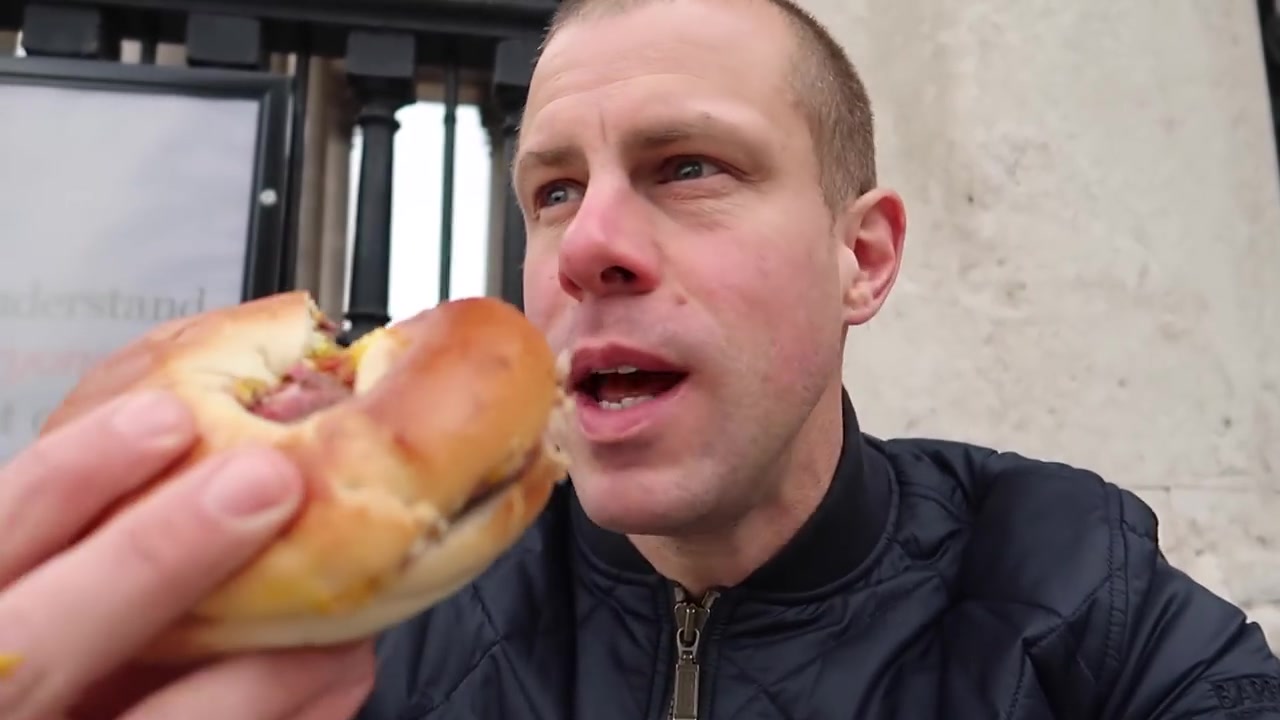 Barry Roberts tasting a salt beef bagel from Gaby’s Deli in 2018
