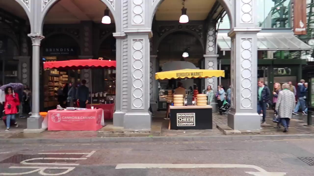 Ornate Victorian market entrance and food stalls at Borough Market