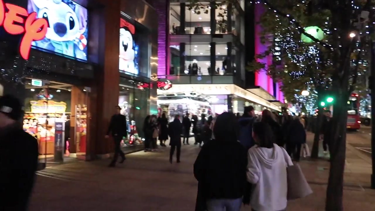 The Disney Store entrance and shoppers on Oxford Street at Christmas in 2018