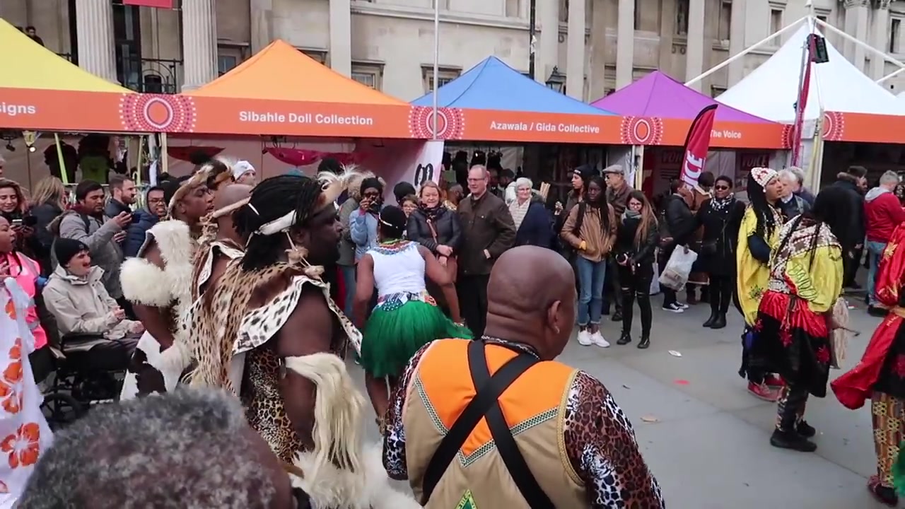 Dancers performing in a crowd circle at Africa on the Square in 2018