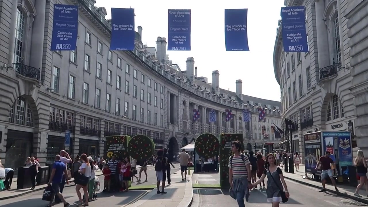 Crowds walking along traffic-free Regent Street towards Piccadilly Circus in 2018