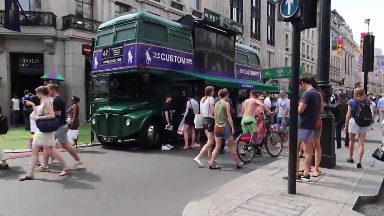Vintage green double-decker bus and pedestrians at Regent Street Summer Streets 2018