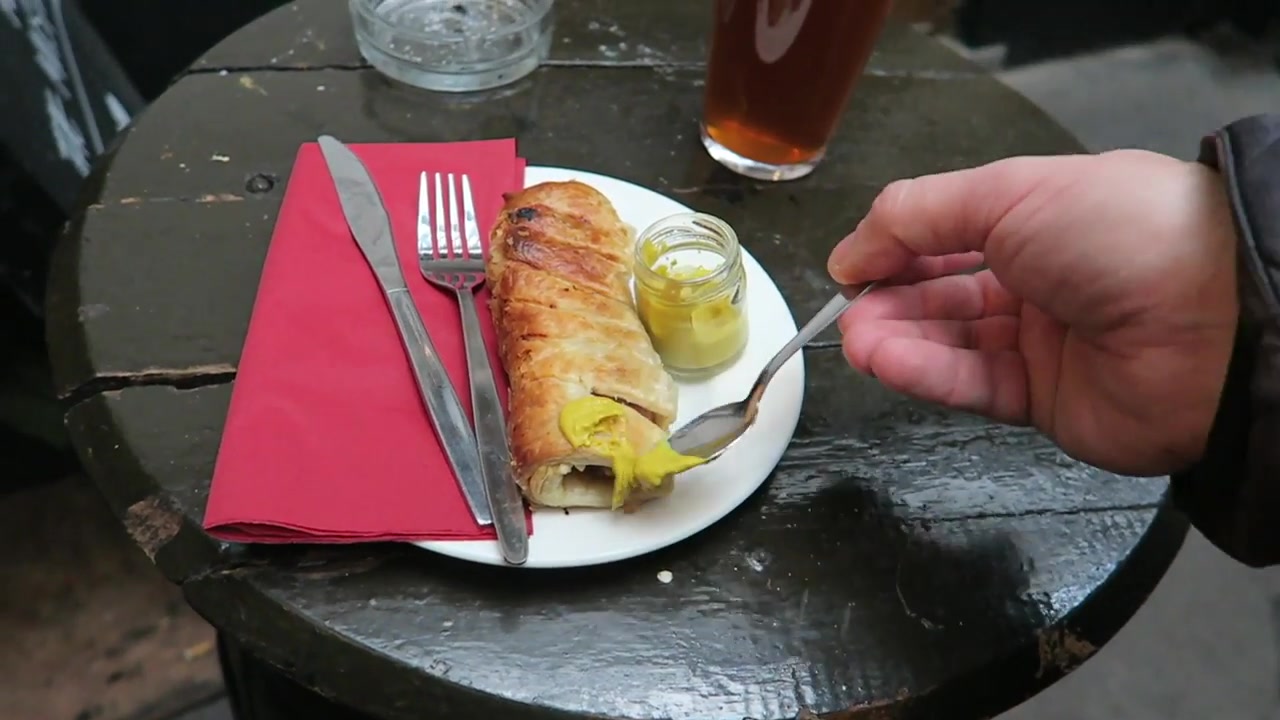 Homemade sausage roll with English mustard and a pint of London Pride at Ye Olde Mitre