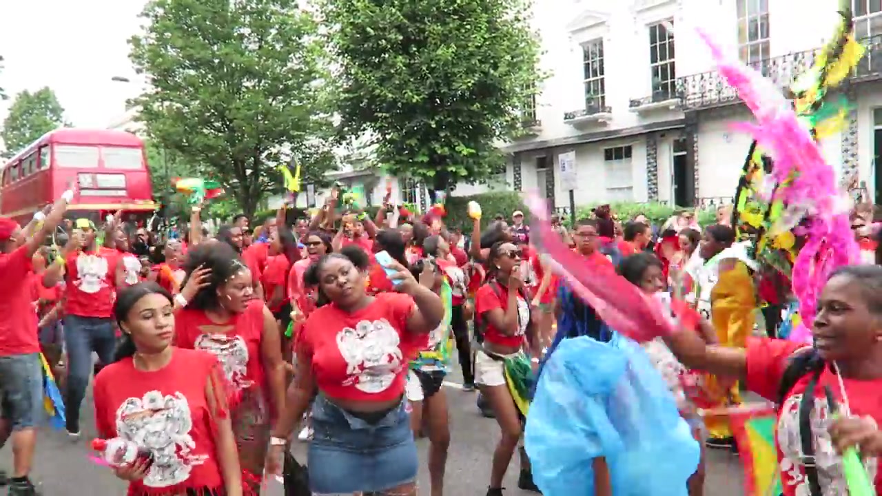 Colourful Carnival dancers in red blue and pink costumes