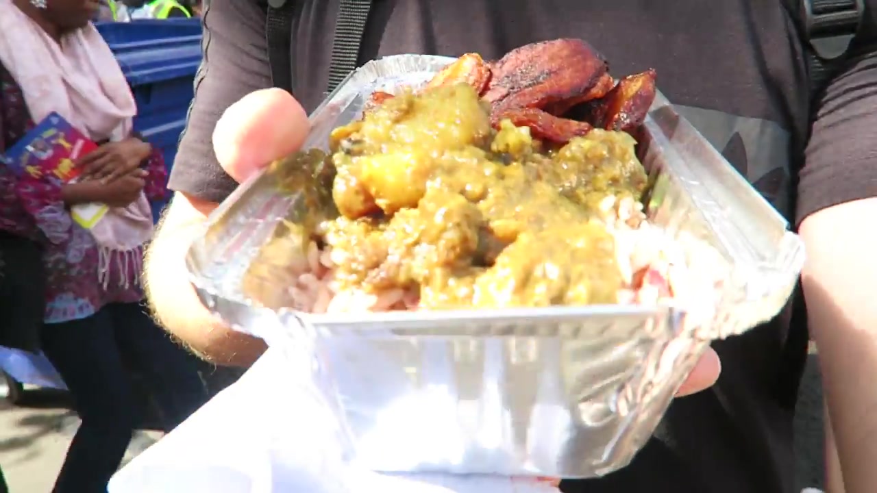 Curry goat with rice and peas and fried plantain served at Notting Hill Carnival