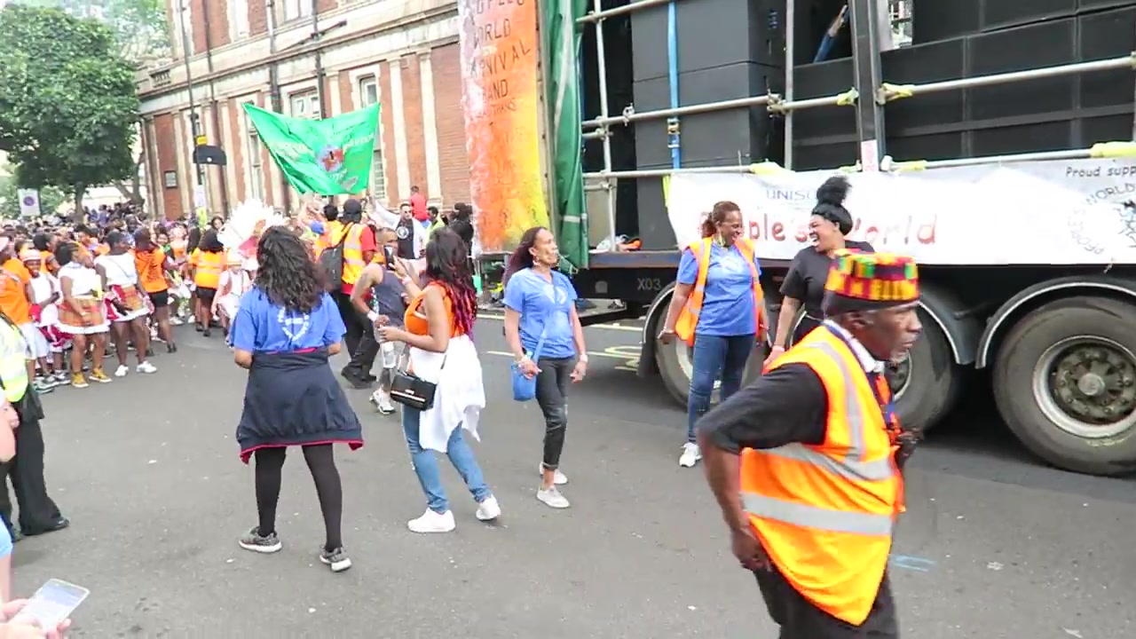 Drummers performing beside a Carnival sound-system truck