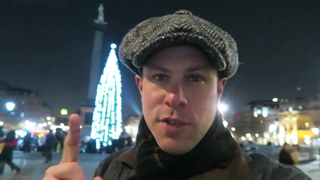 Barry Roberts beside the illuminated Trafalgar Square Christmas tree in December 2016