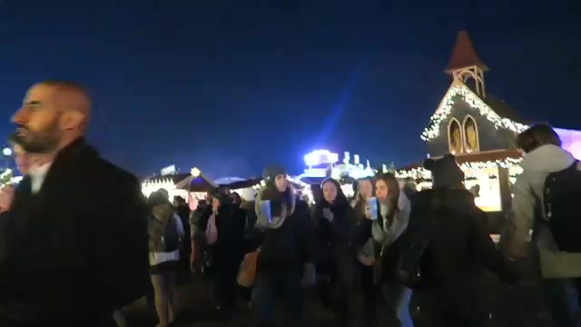 Bavarian-style buildings and visitors at Hyde Park Winter Wonderland 2016