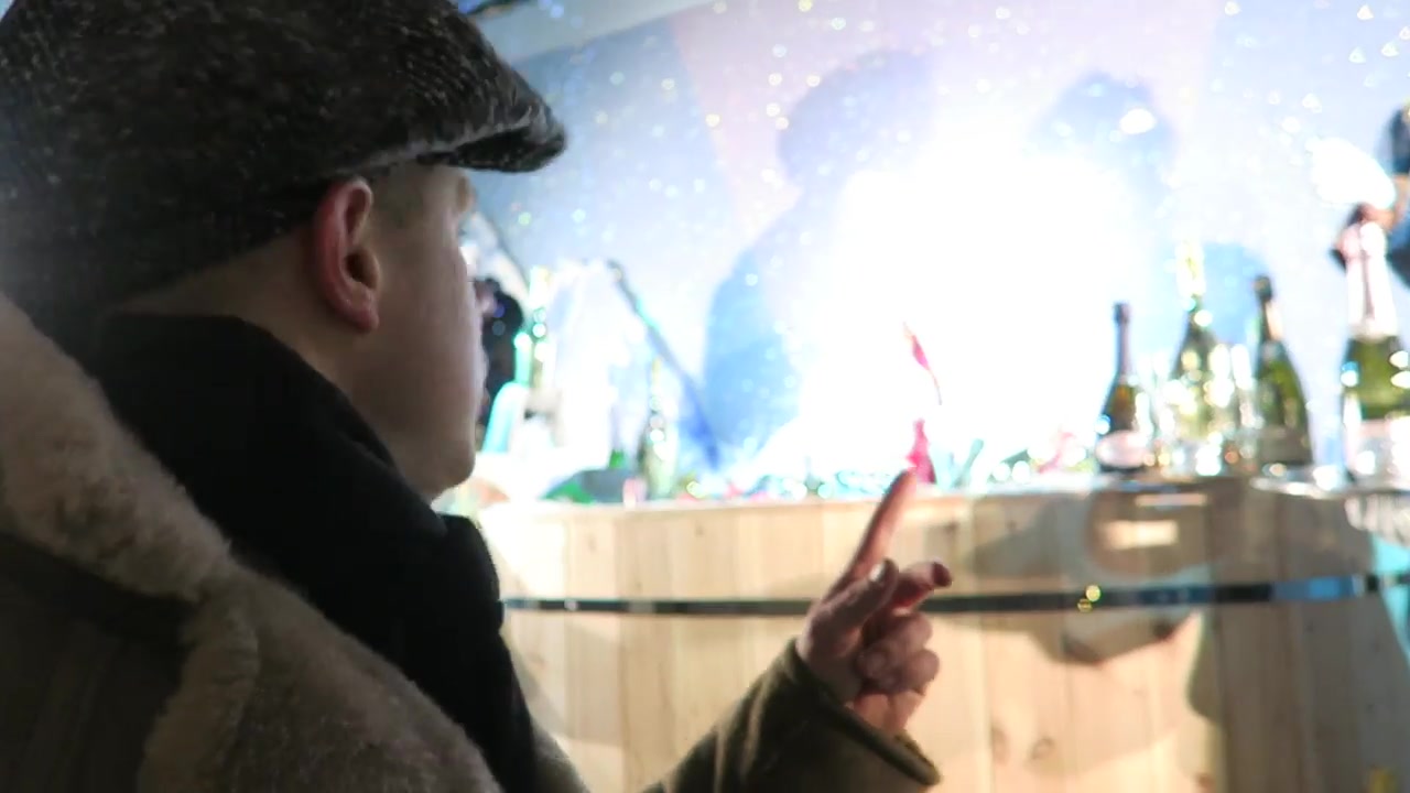 Champagne party scene in the Selfridges Christmas windows on Oxford Street in 2016