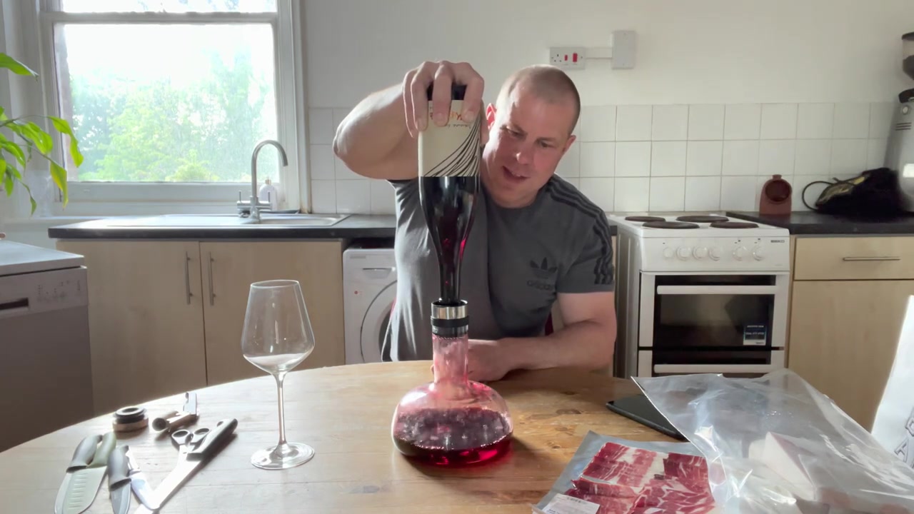 Barry Roberts decanting red wine for a Borough Market tasting