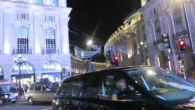 Crowds and illuminated buildings at the Regent Street Christmas lights event in 2016