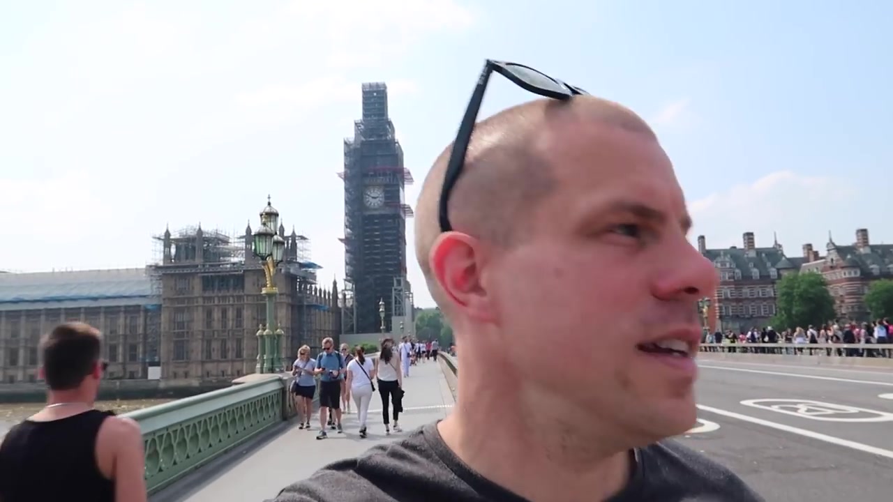 Barry Roberts with the scaffolded Elizabeth Tower behind him on Westminster Bridge