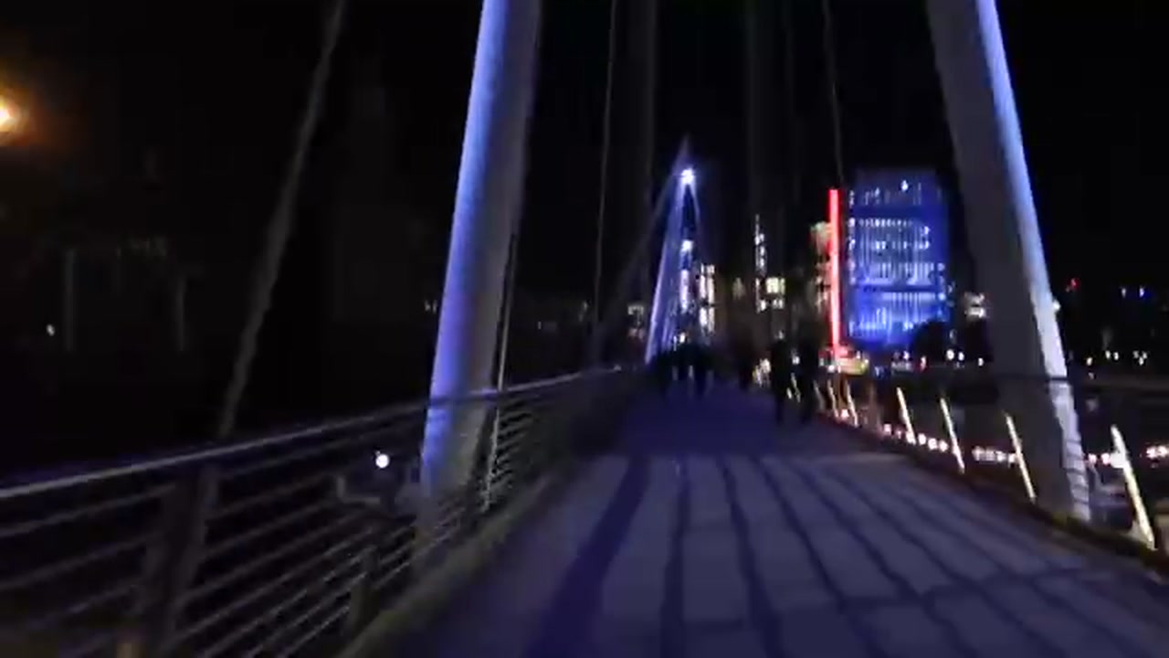 Golden Jubilee Bridge and London skyline at night