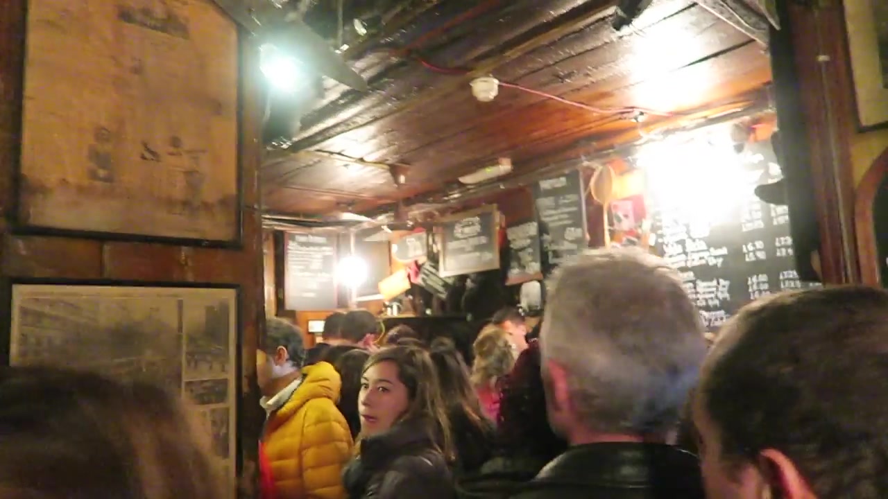 Crowded vaulted cellar interior at Gordon’s Wine Bar in London