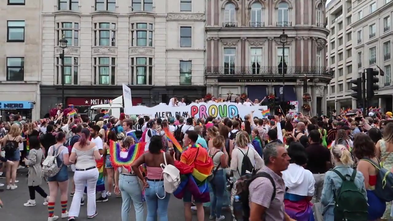 Parade participants and spectators in central London.