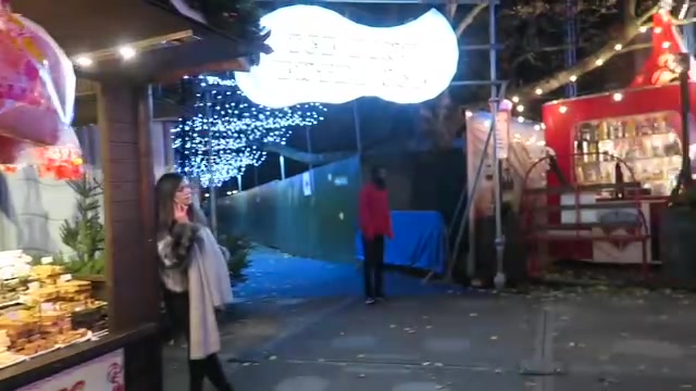 Visitors beneath an illuminated entrance at Hyde Park Winter Wonderland 2016
