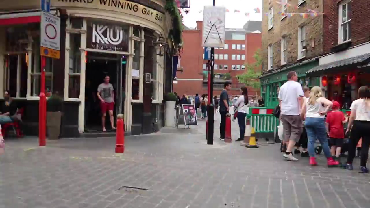 People walking through London Chinatown on a summer afternoon in 2018