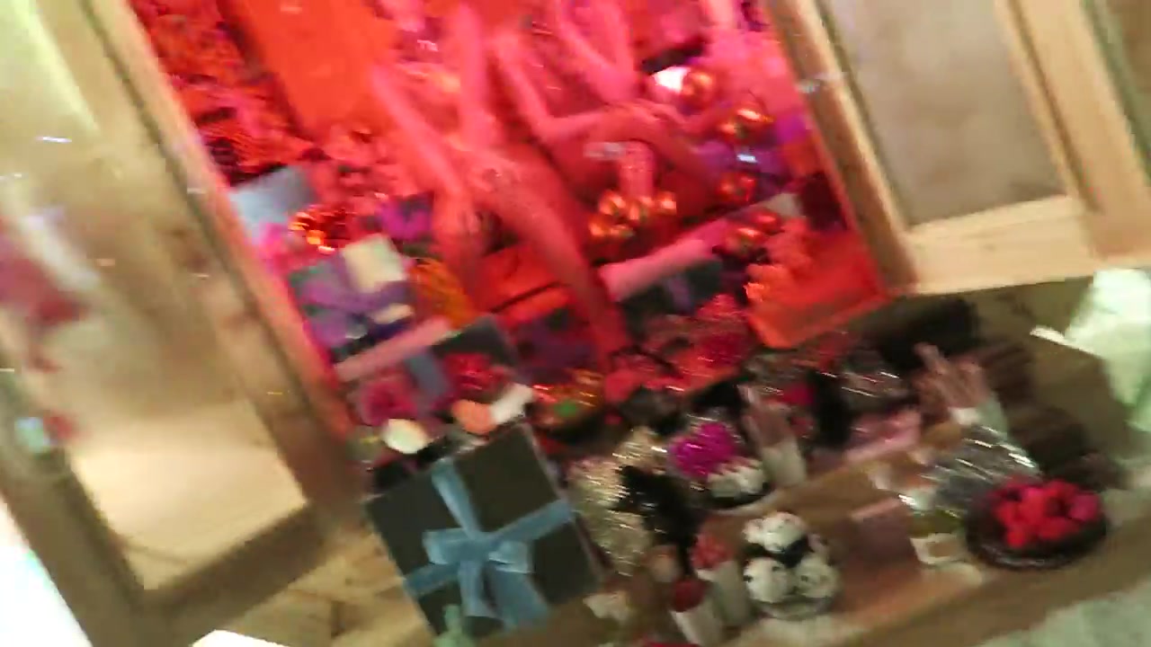 Colourful Christmas gifts displayed in a Selfridges Oxford Street window in 2016