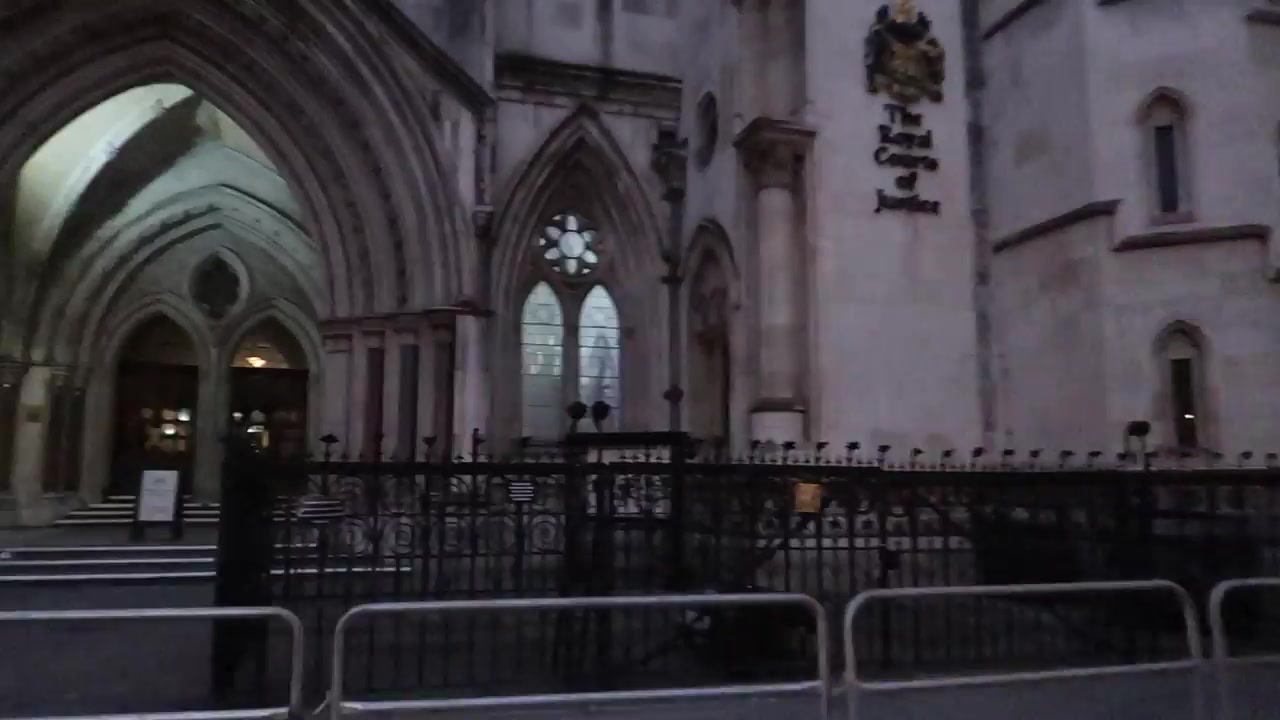 Royal Courts of Justice on the Strand in London at night