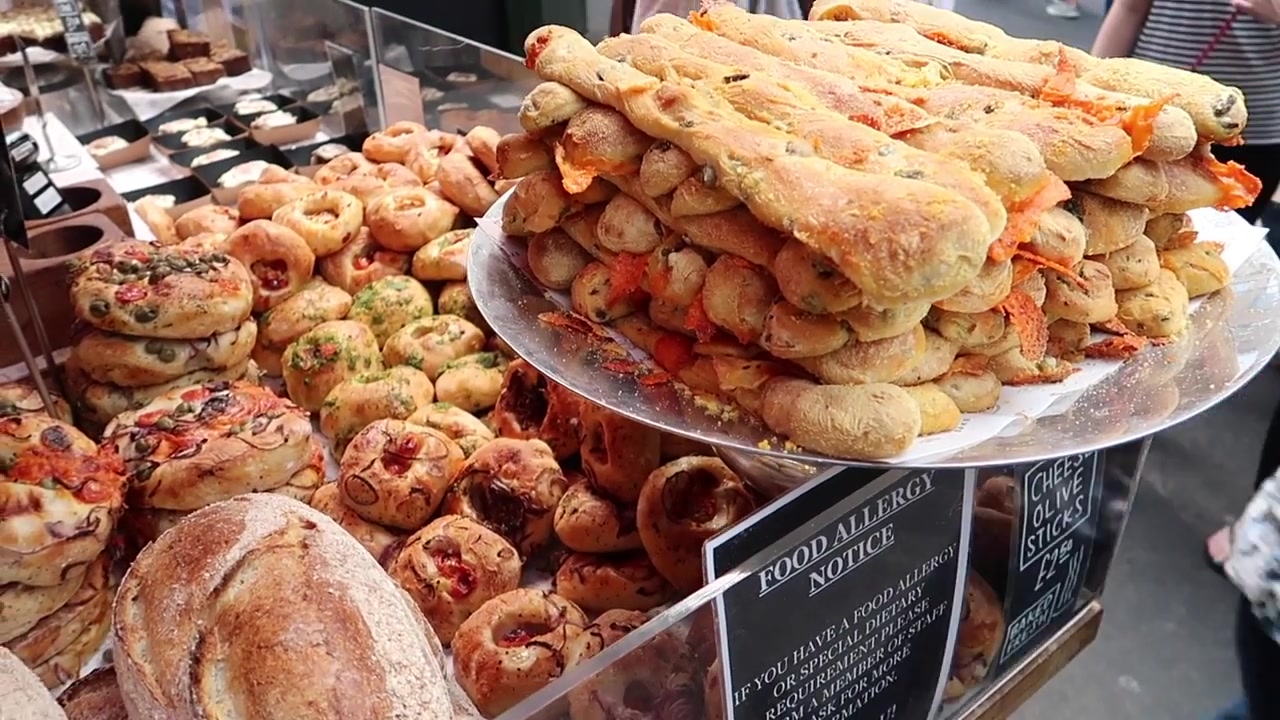 Savoury baked goods displayed at the Bread Ahead counter.