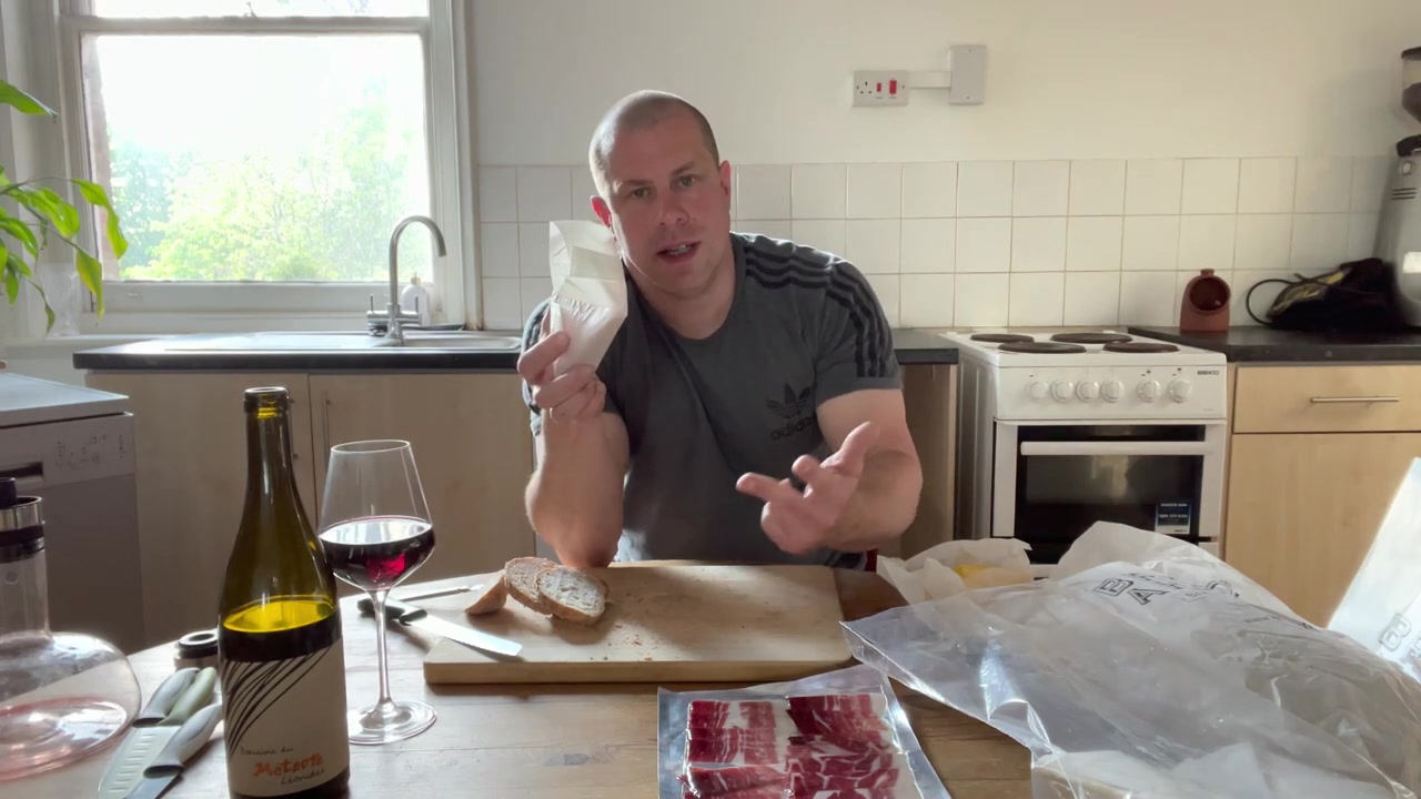 Sparkenhoe Red Leicester being tasted with sourdough and wine
