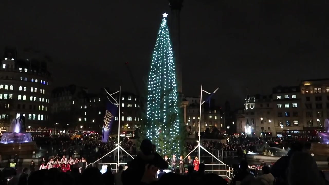 The Christmas tree and carol singers in Trafalgar Square.