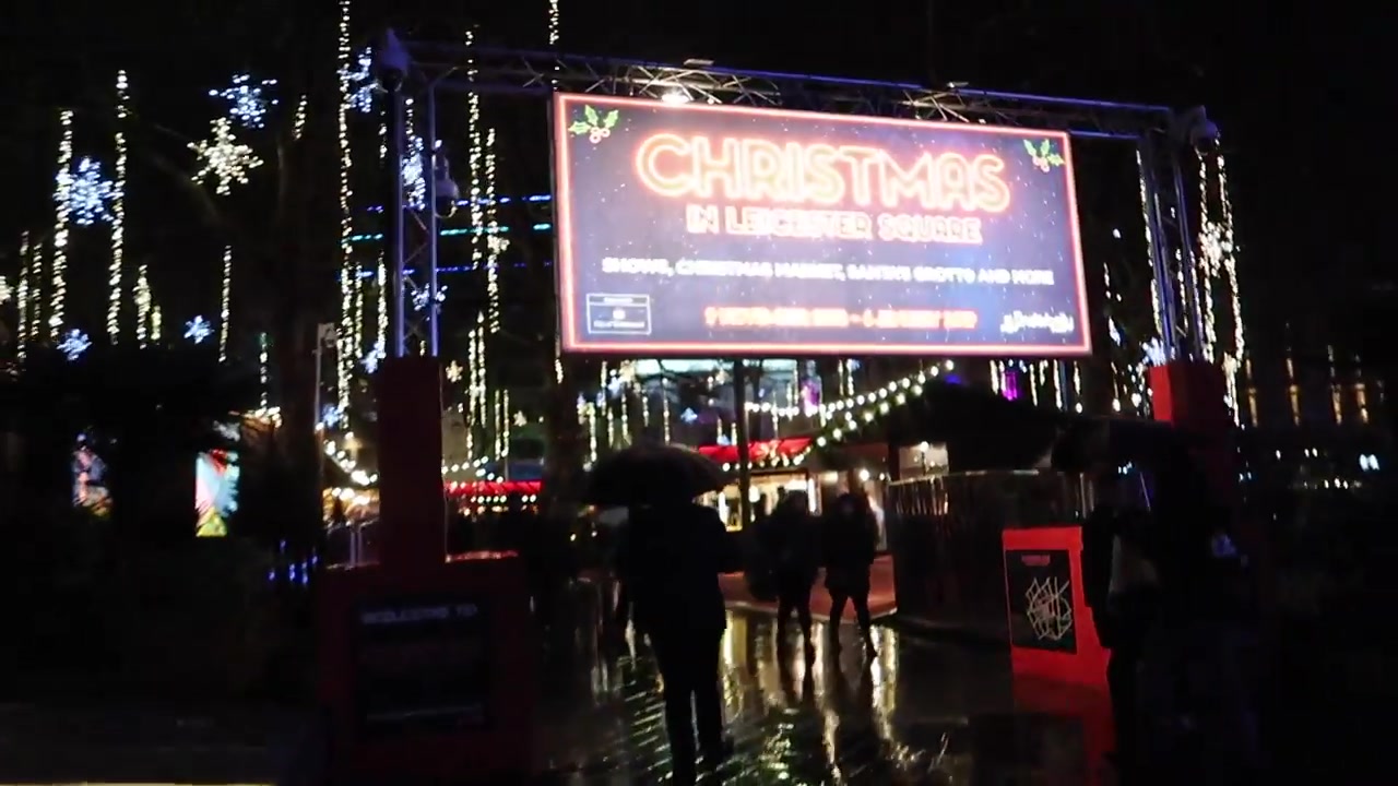 The entrance to Christmas in Leicester Square on a rainy evening in 2018.