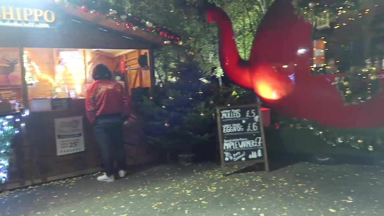 Festive street-food stall decorated with a large red reindeer at the Southbank Christmas market