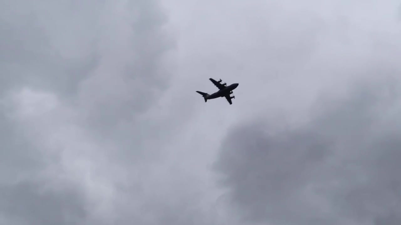 Large RAF aircraft flying above London during the RAF100 centenary display