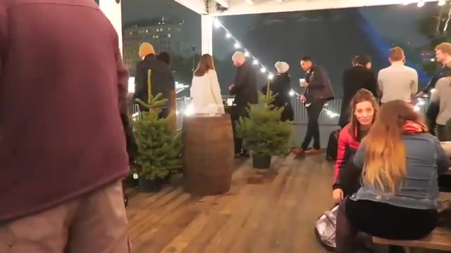 Visitors seated inside the two-storey Rekorderlig Cider Lodge on the South Bank
