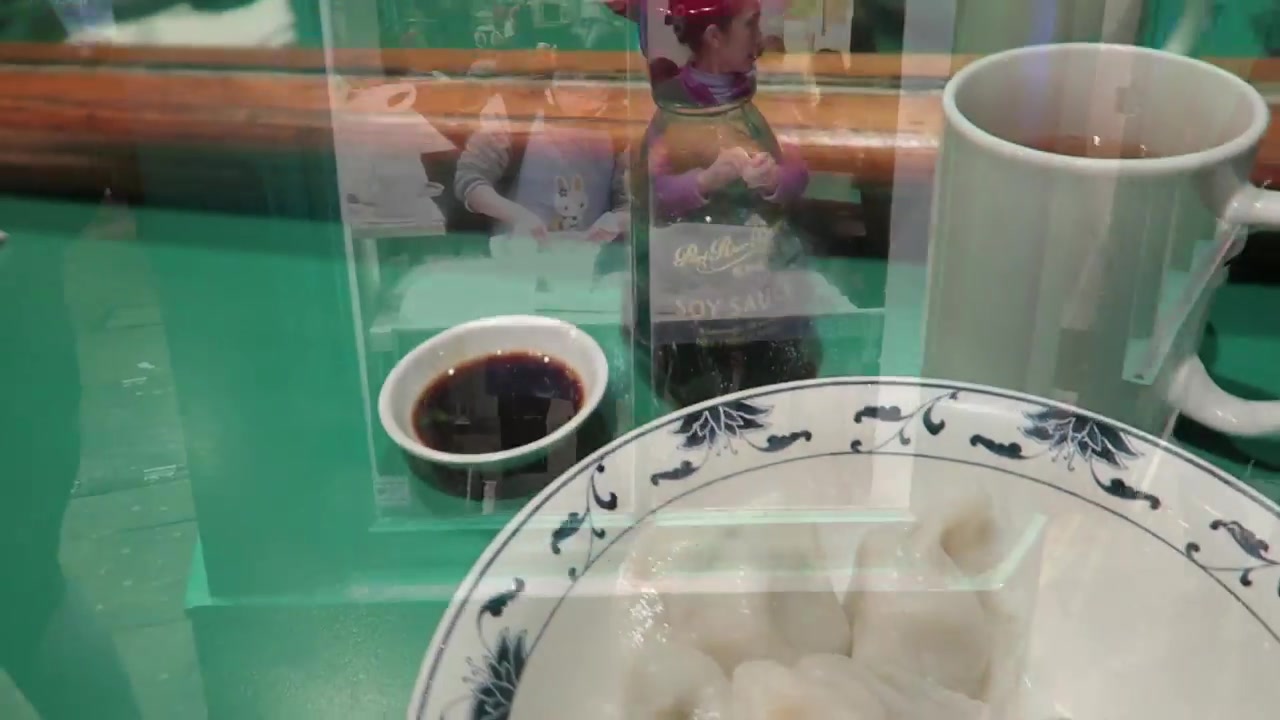 Fresh dumpling filling and wrappers being prepared inside Jen Café