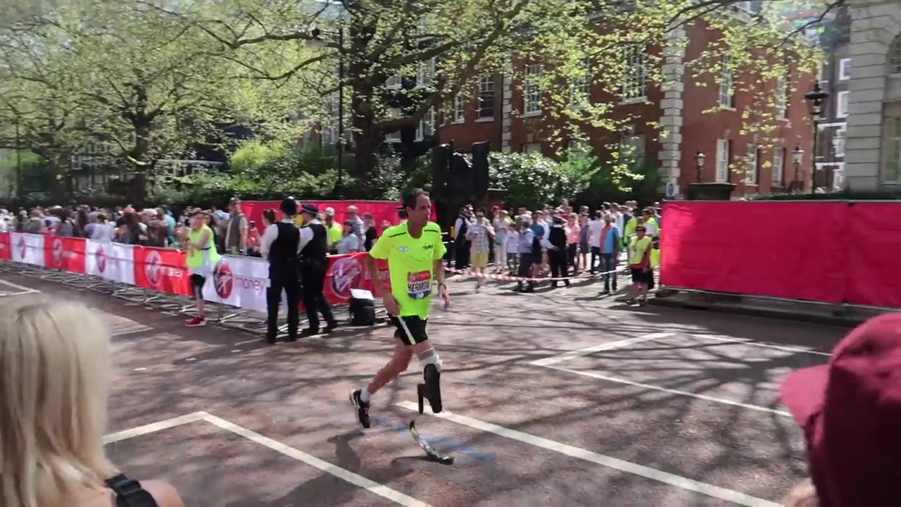 London Marathon runner passing spectators on Birdcage Walk in 2018