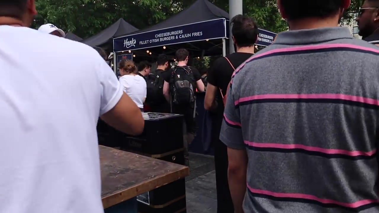 Customers gathered around a street-food stall at Southbank Centre Food Market