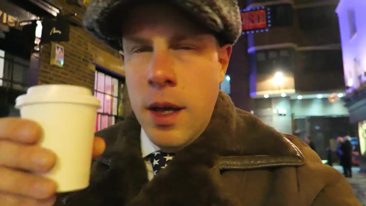 Barry Roberts walking through Soho under blue Christmas lights in December 2016