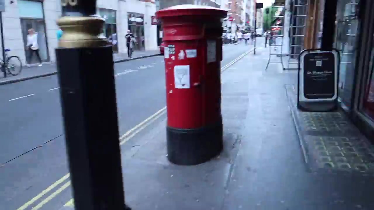 A summer street scene during the walk through Soho towards Frith Street