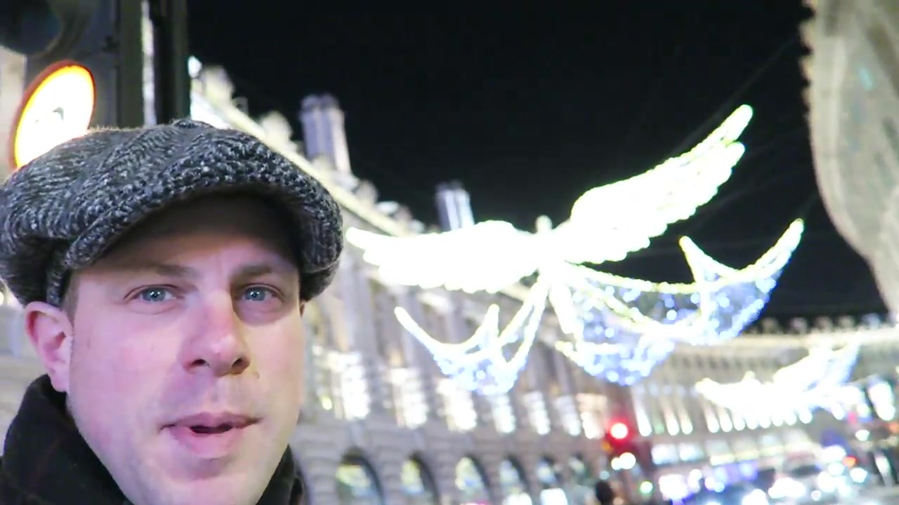Illuminated angel decorations above a busy West End street in London in 2016