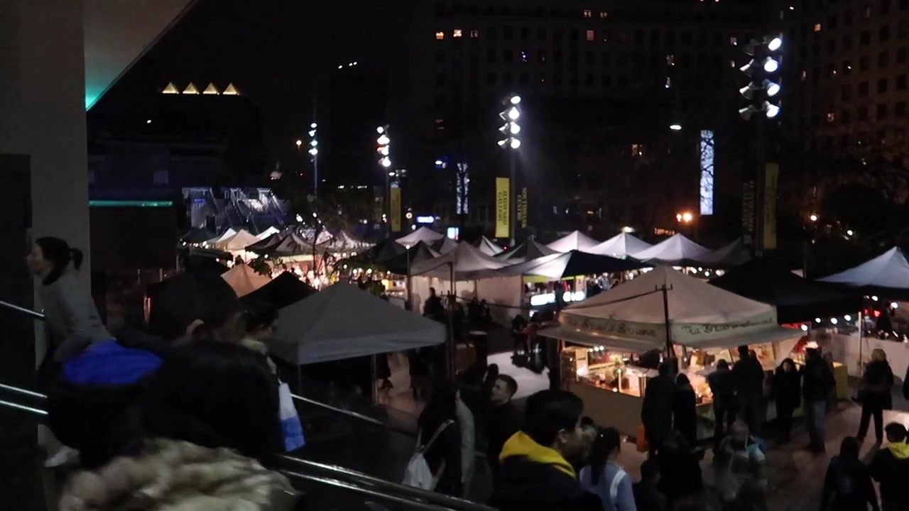 Food stalls at the South Bank Christmas market after dark.