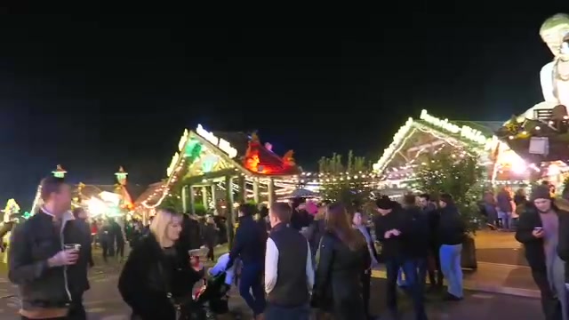 Evening visitors among the lights at Hyde Park Winter Wonderland 2016
